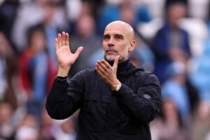 ‘Come on you Irons’: Pep Guardiola urges West Ham to do Man City title race favour against Arsenal